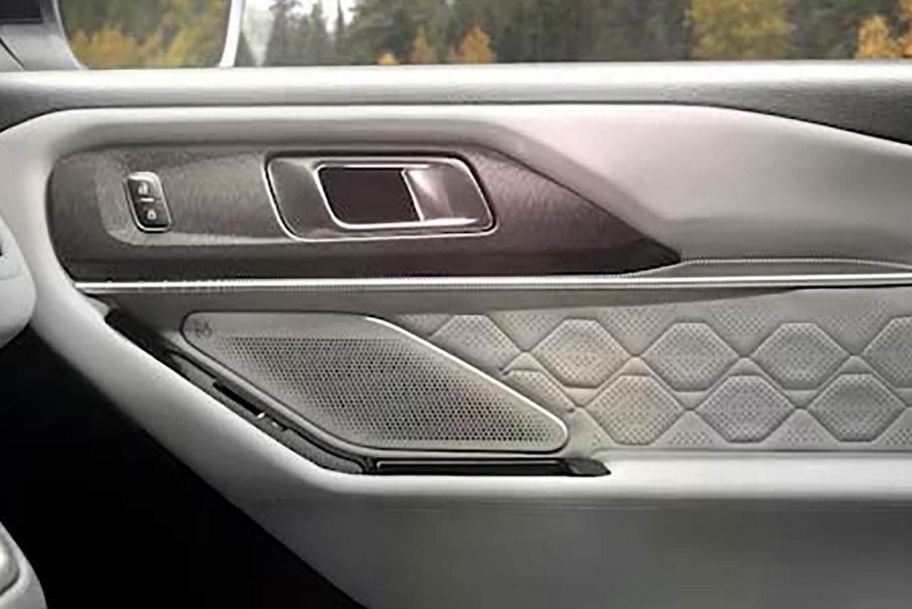 Interior door trim and speaker detail in a 2027 Ford Explorer.