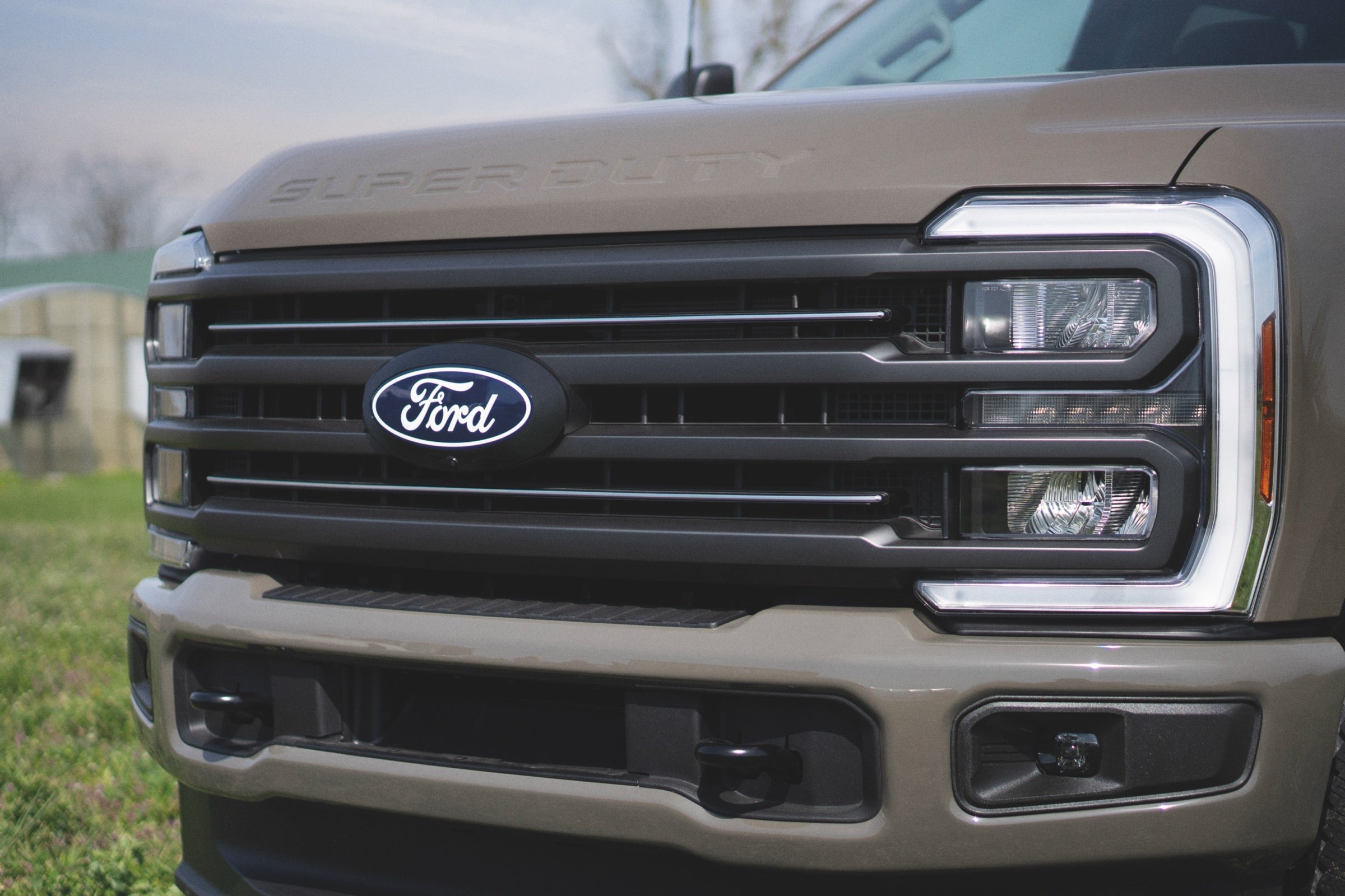 Close-up of the grille and LED headlights on a 2027 Ford F-250 Super Duty.